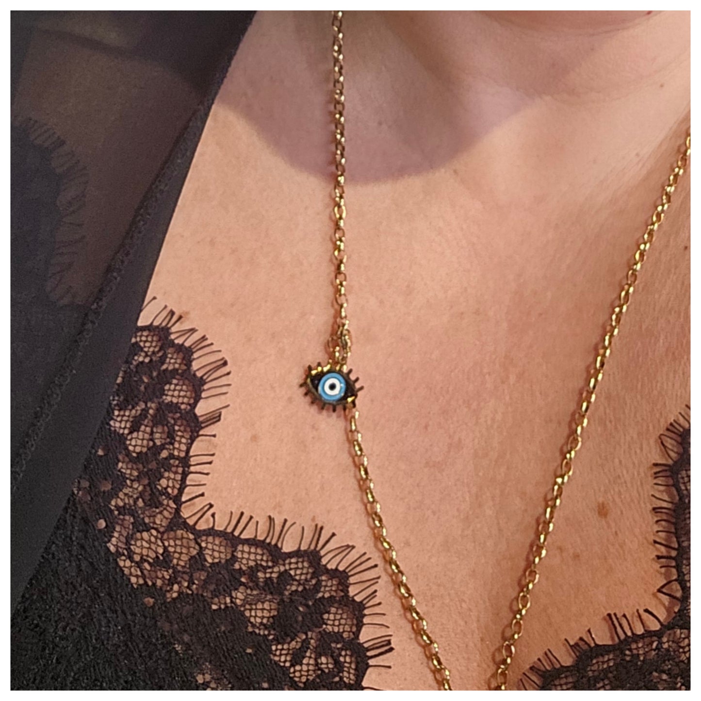 Breloque œil bleu doré