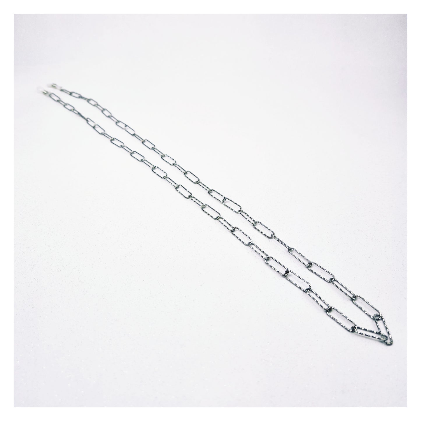 Chaîne de lunettes argentée effet diamanté acier inoxydable